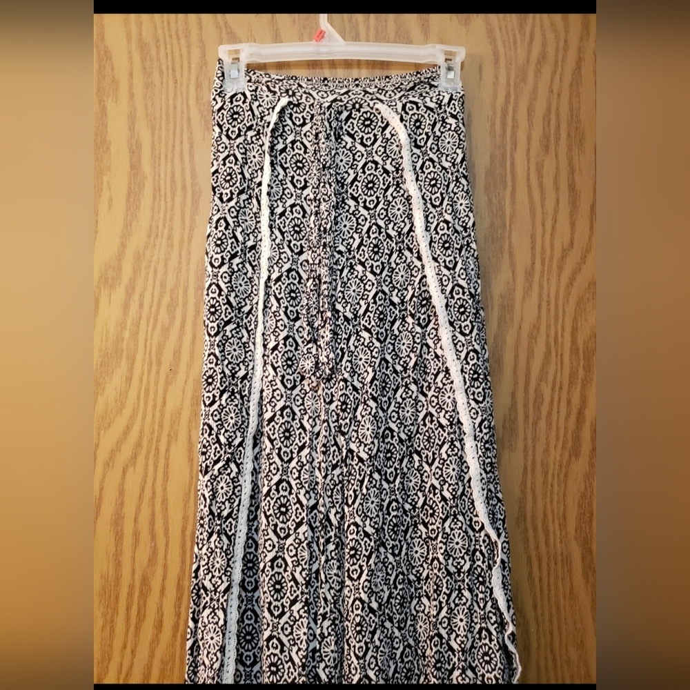 Really pretty black and white patterned "pants" with lace lined splits at sides.